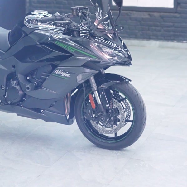 Kawasaki Ninja under red studio light.